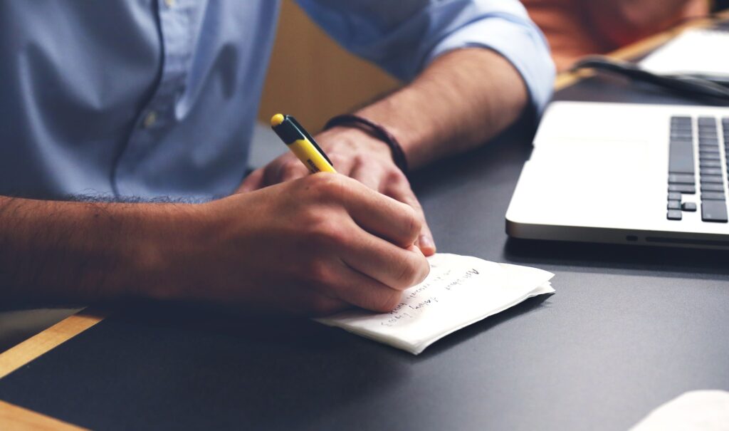 Virtual Job Interview desk man taking notes