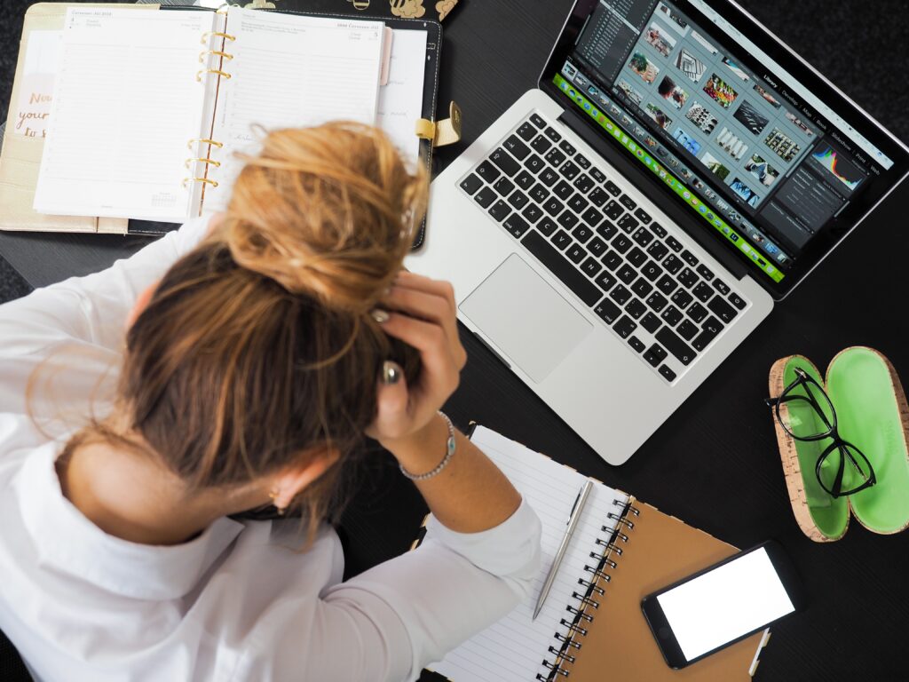 Work-Life balance girl on a computer with frustration