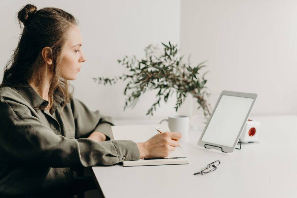 Work-Life Balance girl writing and on a tablet