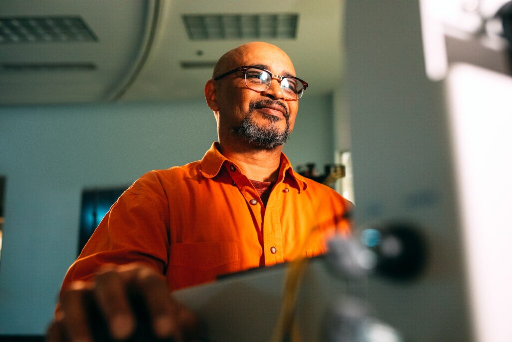 Man working on computer happy 2023