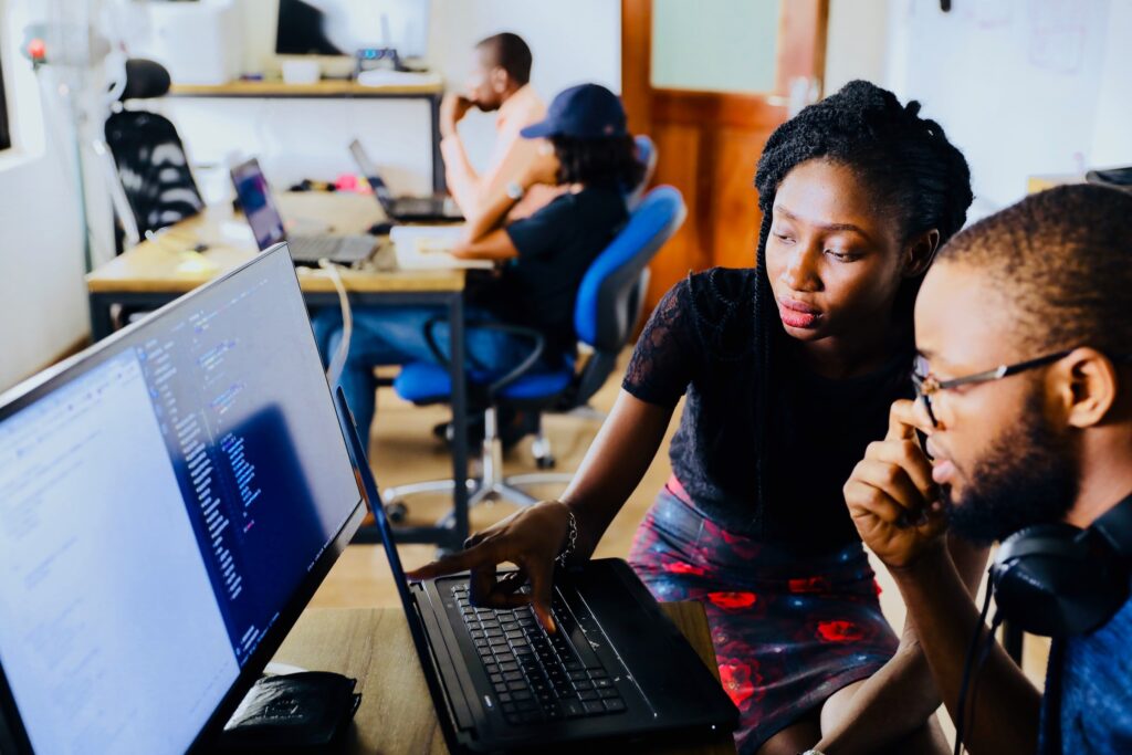 Man and Woman working on a computer together 2023