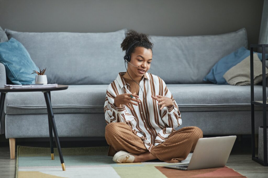 woman working while sitting on the floor work from home