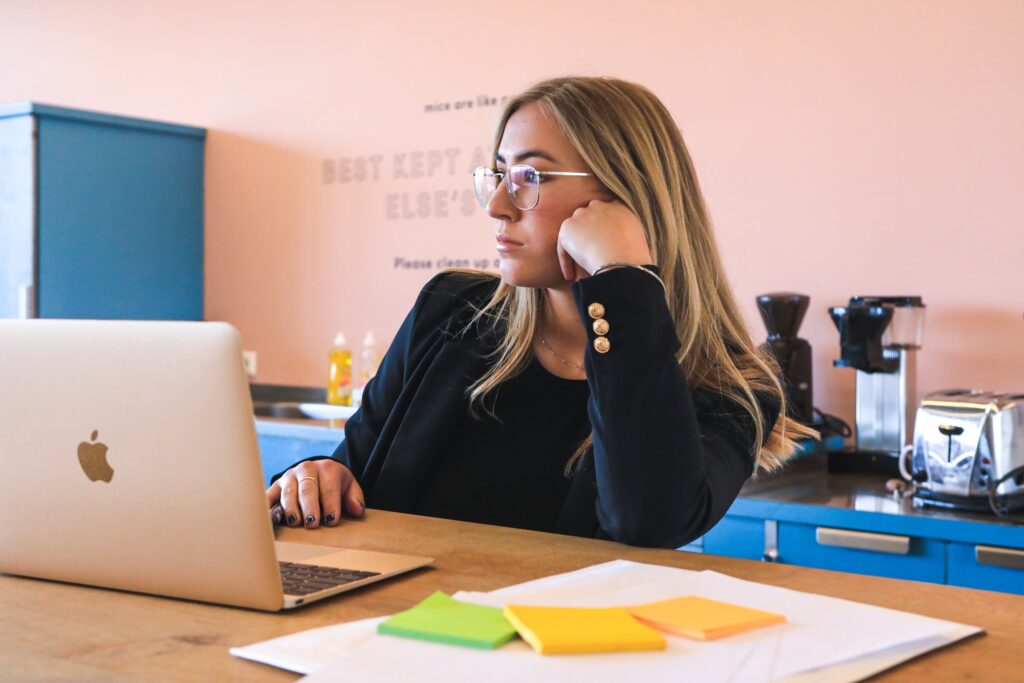 a woman looking bored while working career change