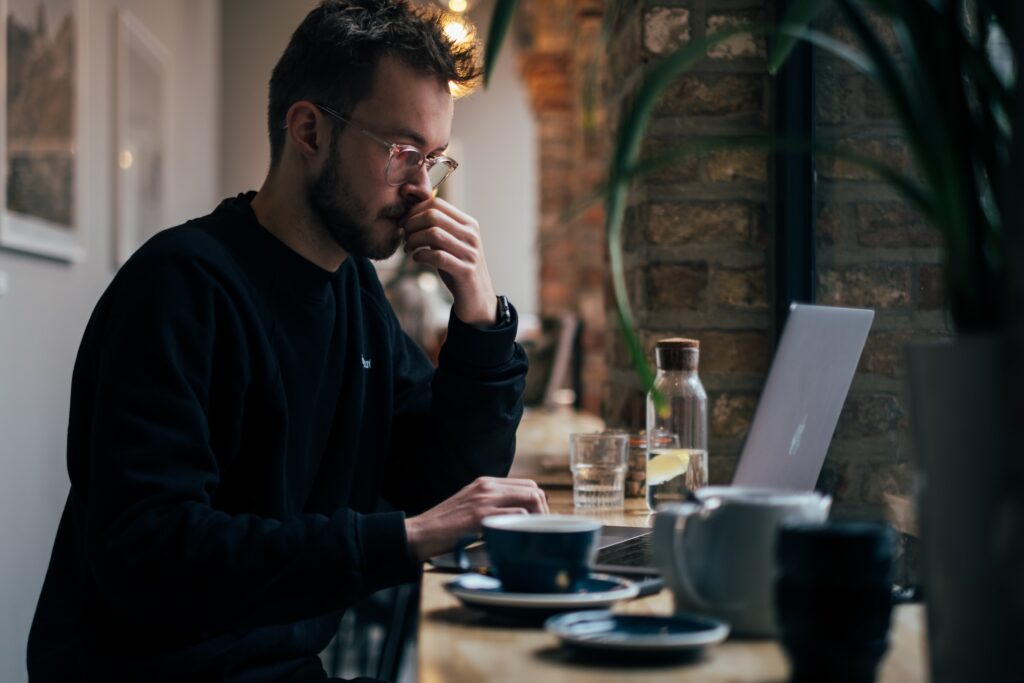 Man on a computer thinking