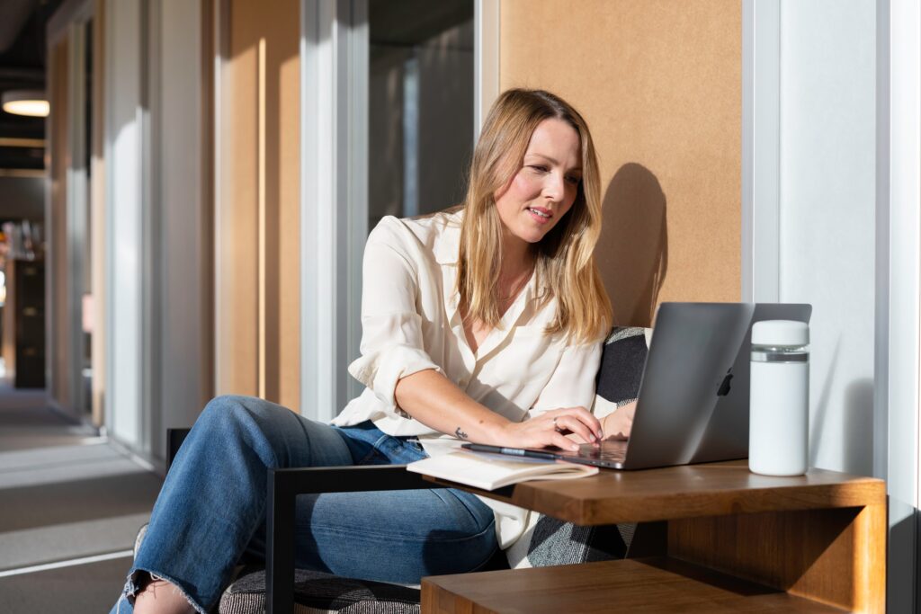 Woman Outside on Computer LinkedIn Profile