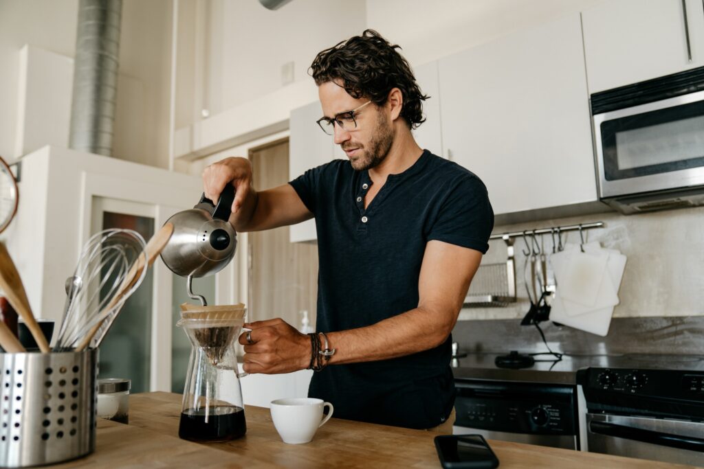 man making coffee morning routine work from home schedule