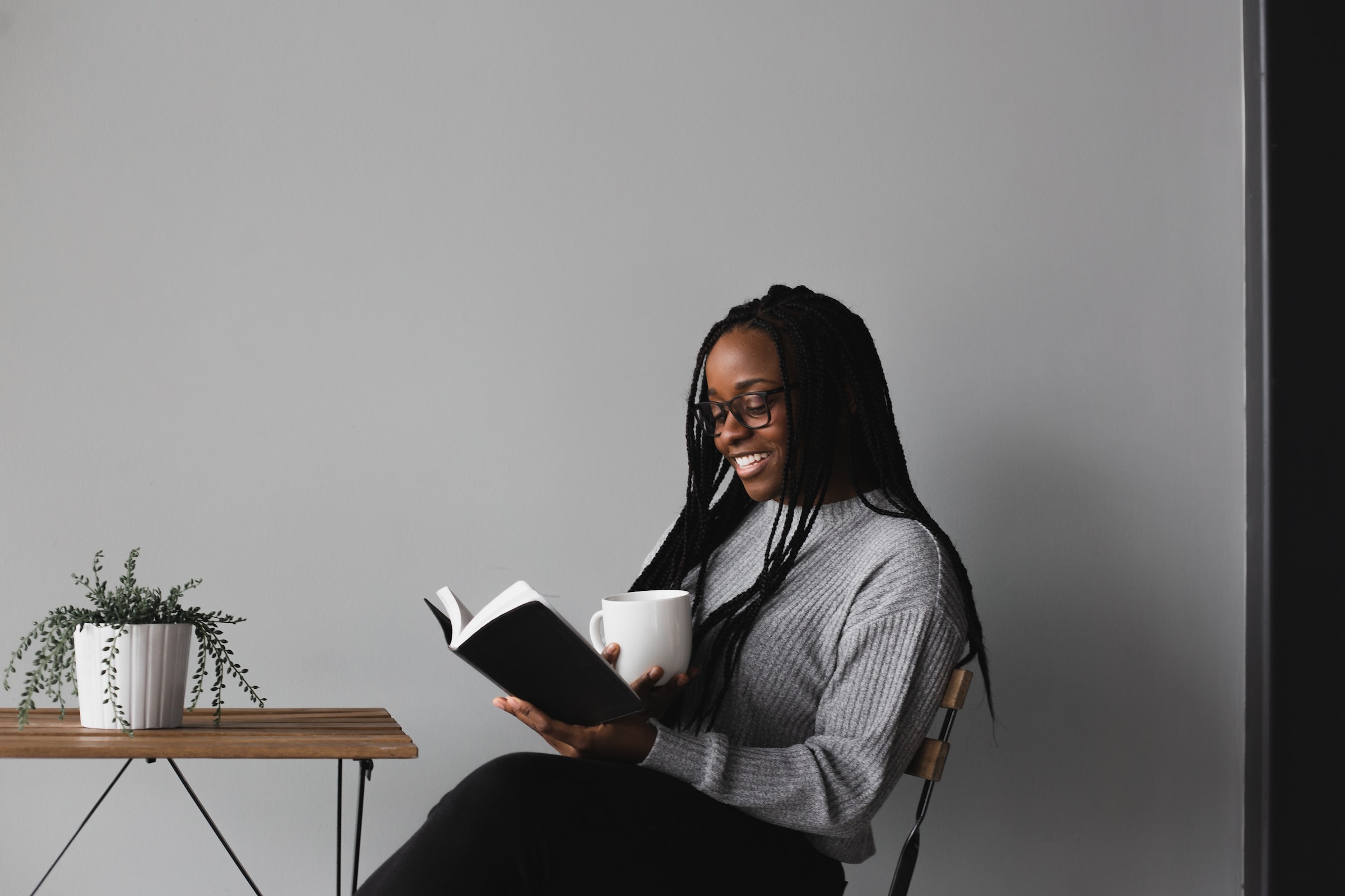 Woman reading a book while sitting passion work