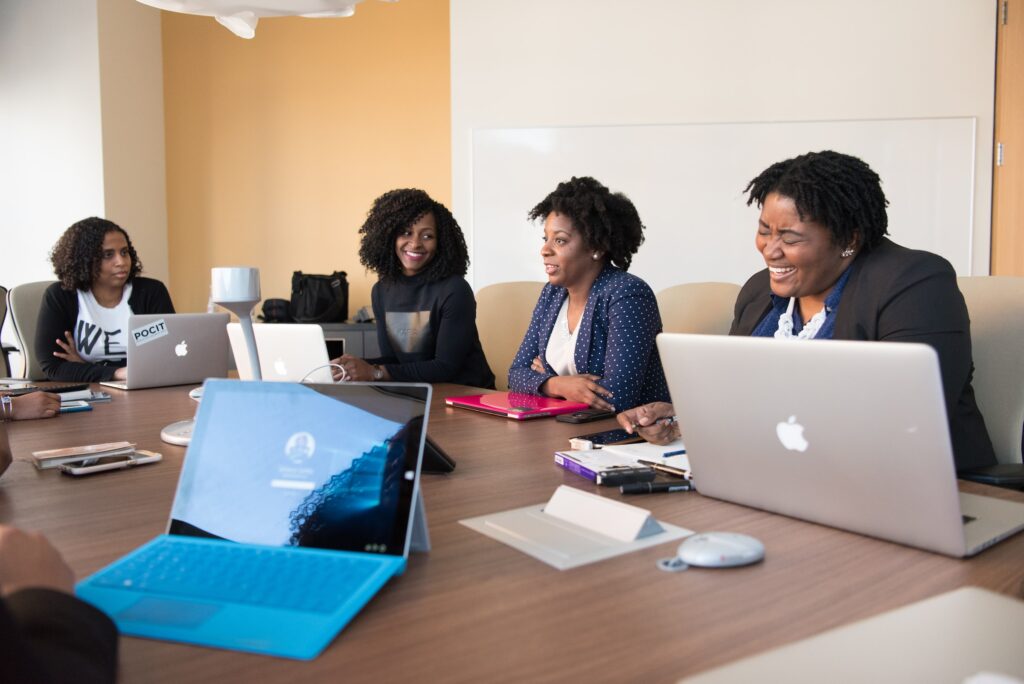 Group of Women working together at a table workplace positivity