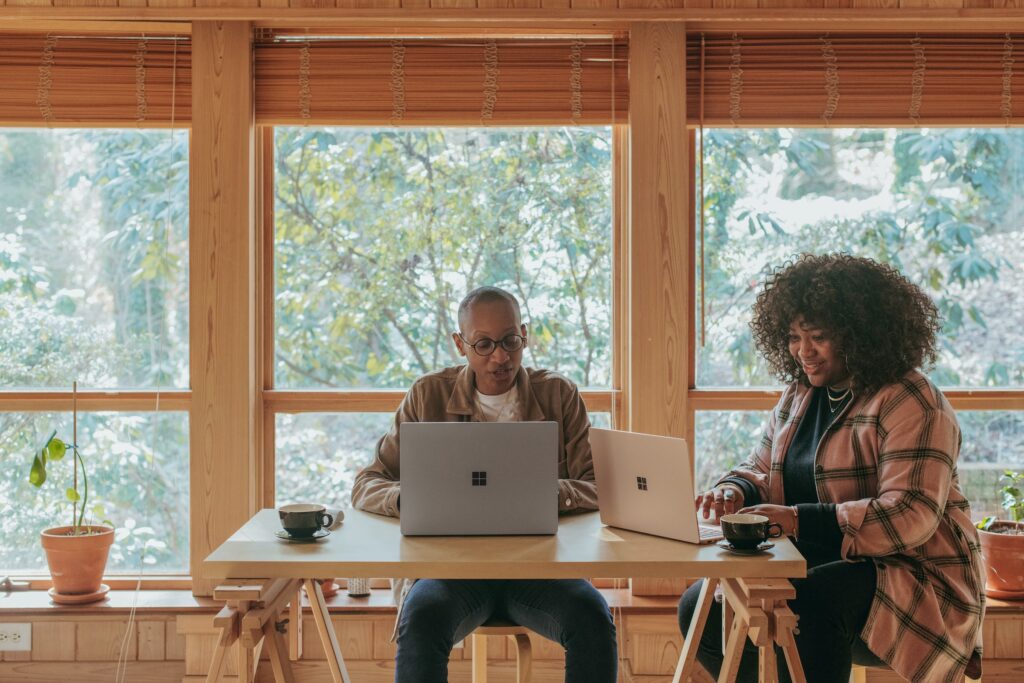 Man and Woman sitting at a table working Career Coaching