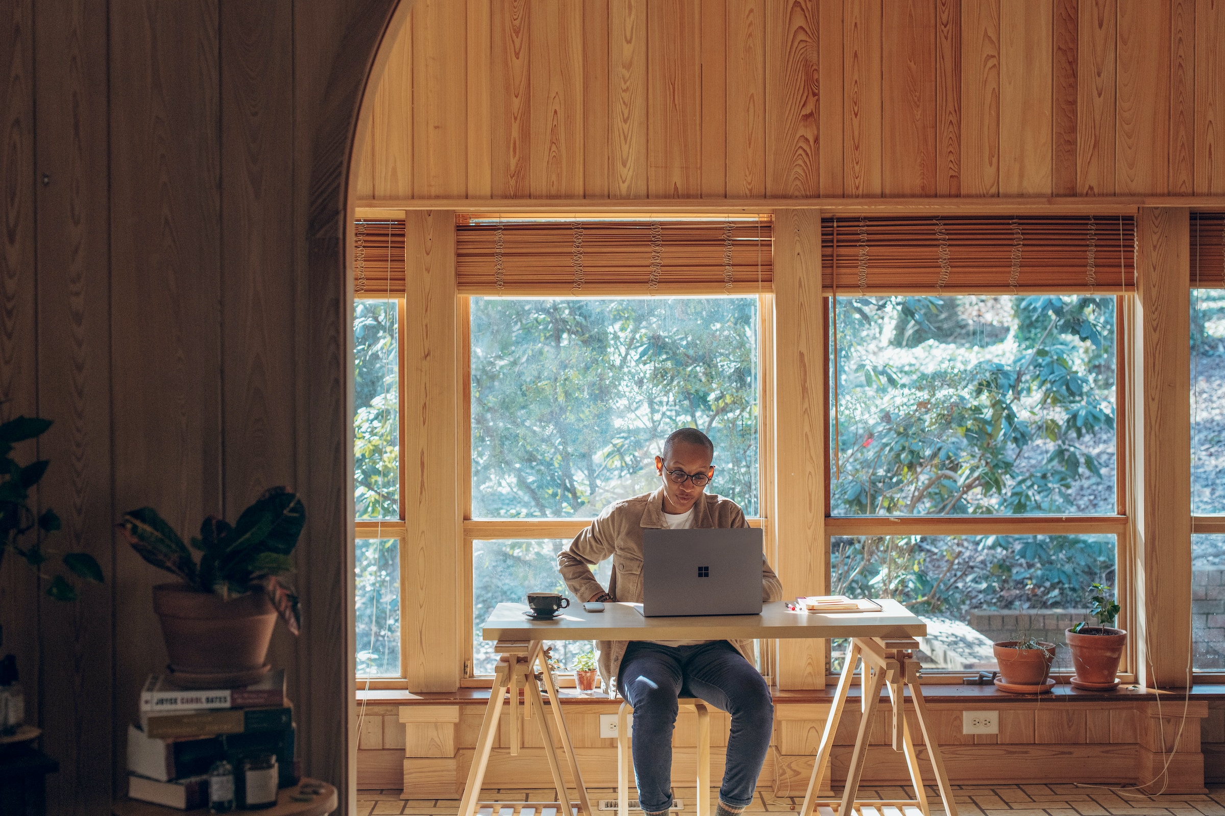 Guy sitting at a table working on a computer