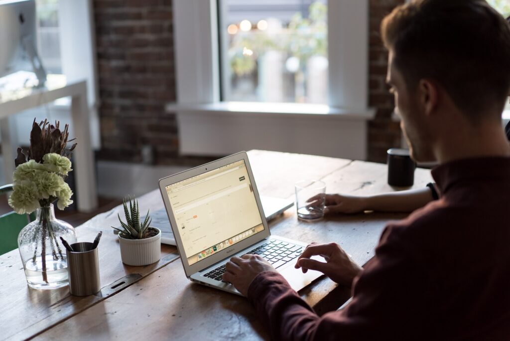 Man Working on laptop on a desk