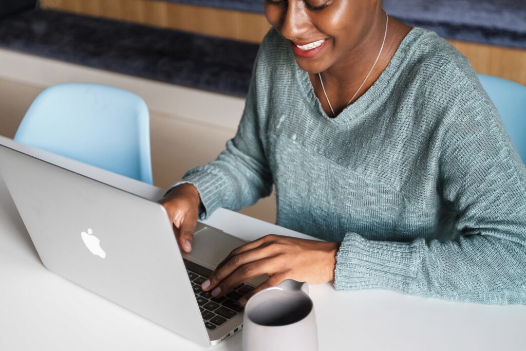 Woman on a Computer Smiling