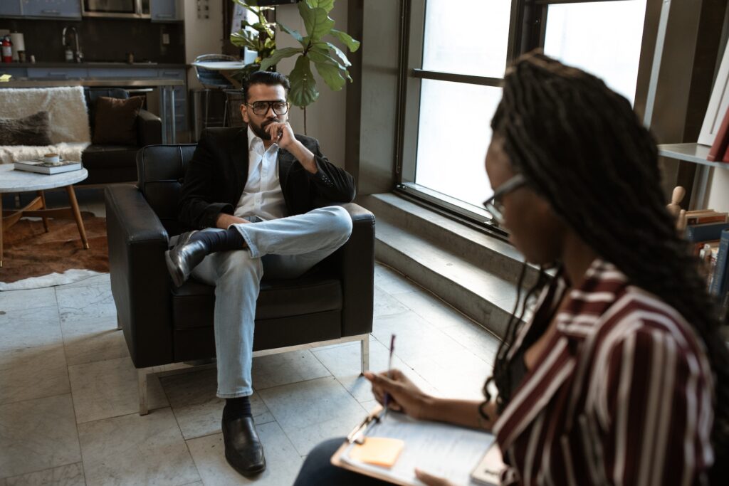 Man Sitting in a Chair getting interviewed