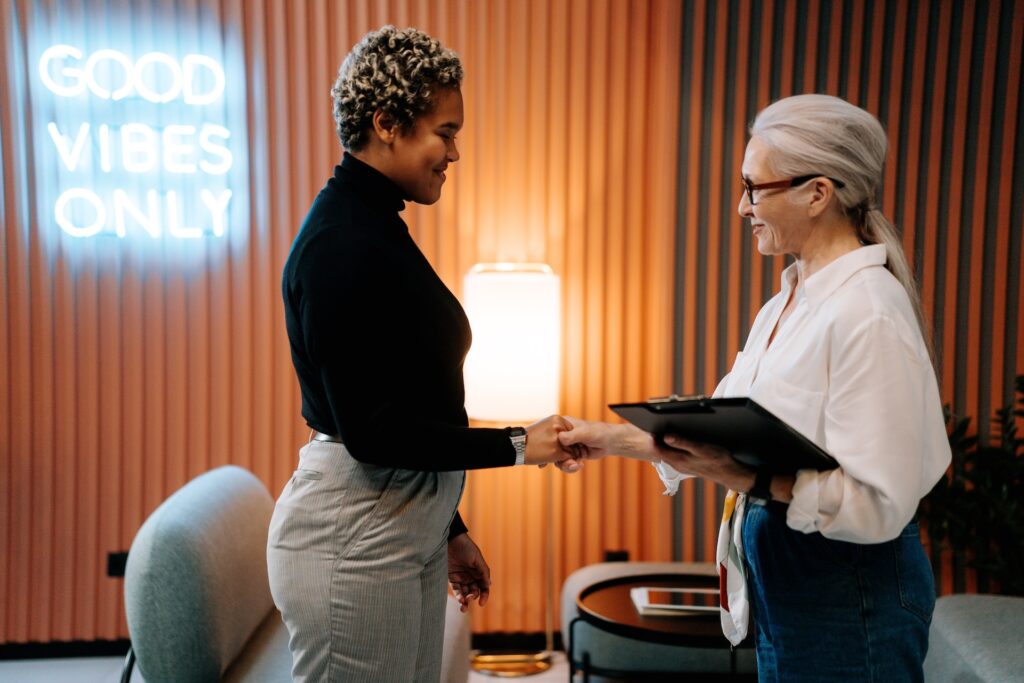 two women shaking hands for a job interview